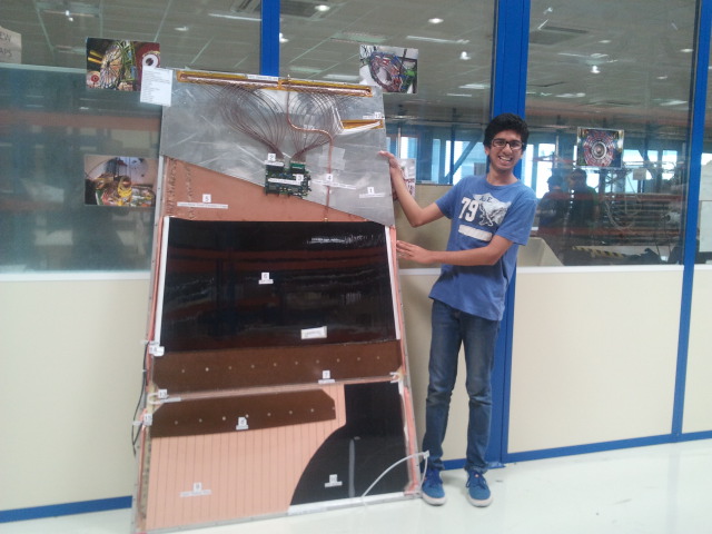 Mihir with the RPC model he built.