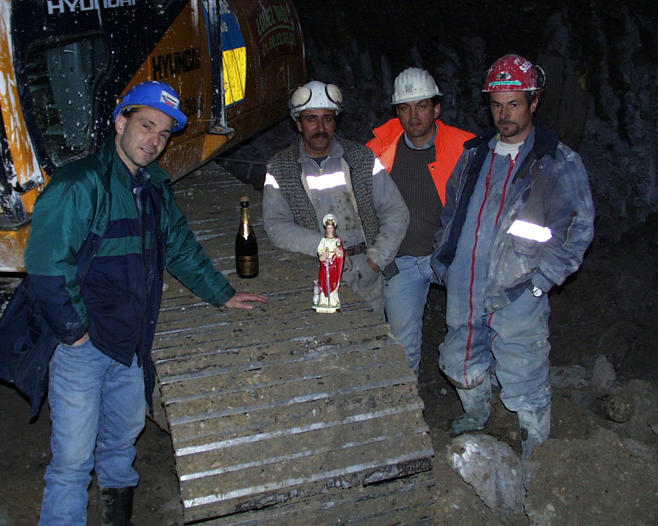 Image 1: The on-site workers with the idol of St. Barbara in 1999.