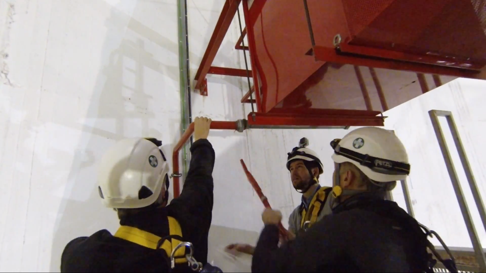 Members of the CMS Safety and Technical Coordination teams removing the foam outlet