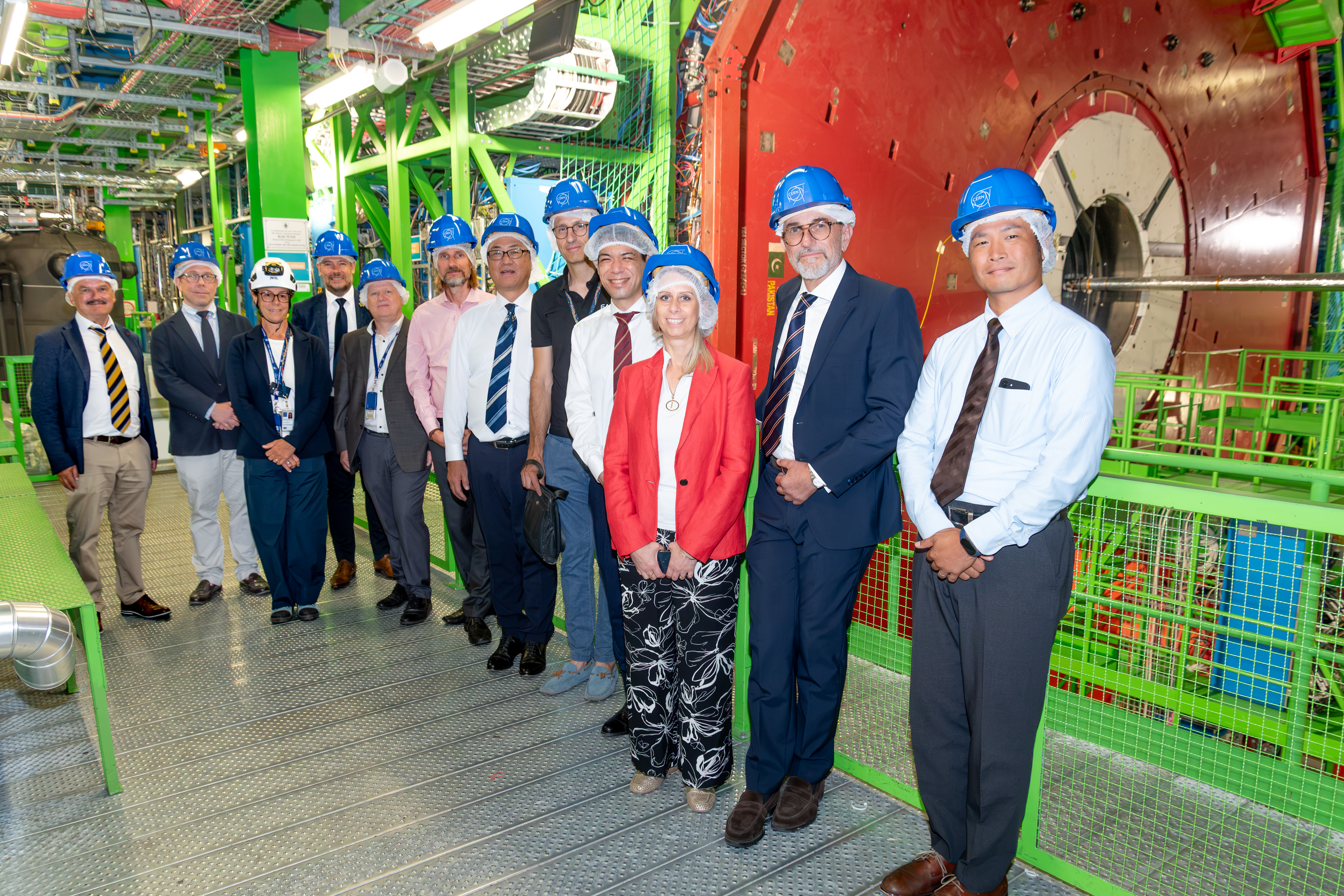 CMS & Hamamatsu representatives in front of the CMS detector