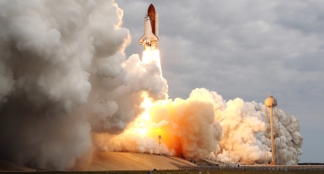 Endeavour carries AMS as it blasts off from the Kennedy Space Center. 