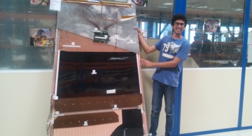 Mihir with the RPC model he built.